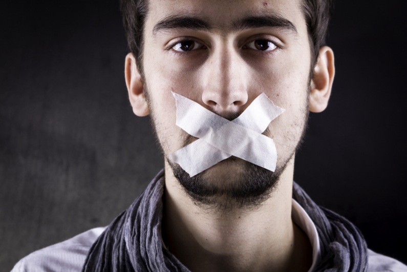 Man with tape over his mouth