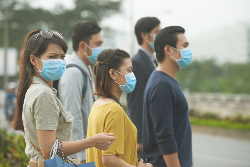 people wearing face masks because of virus outbreak