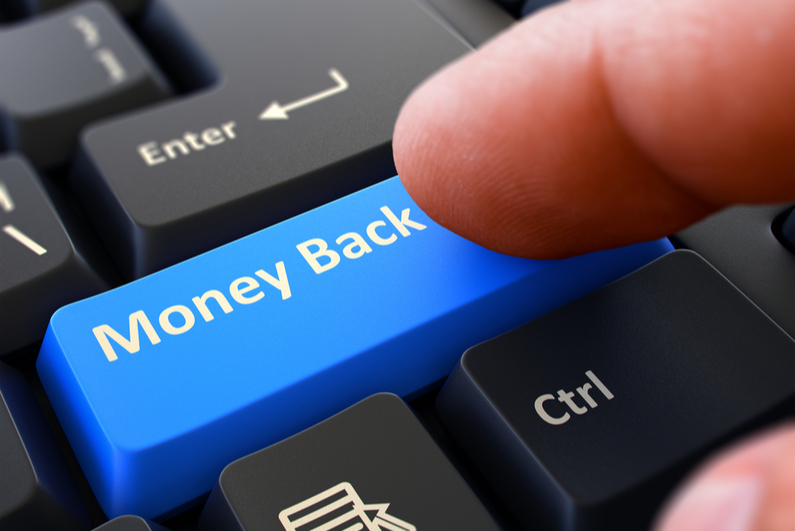 Person pressing "Money Back" button on keyboard