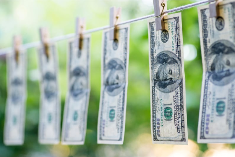 $100 bills on a clothesline