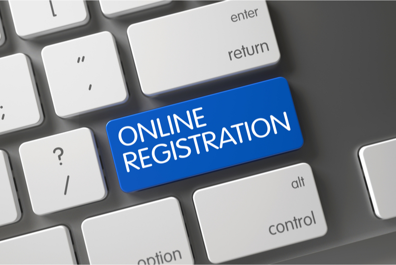 Computer keyboard with a shift key changed to "Online Registration"