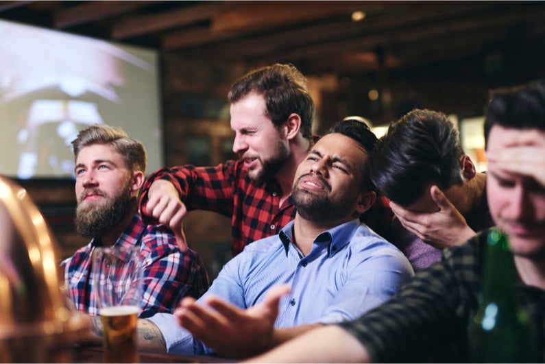 upset sports fans at a sports bar