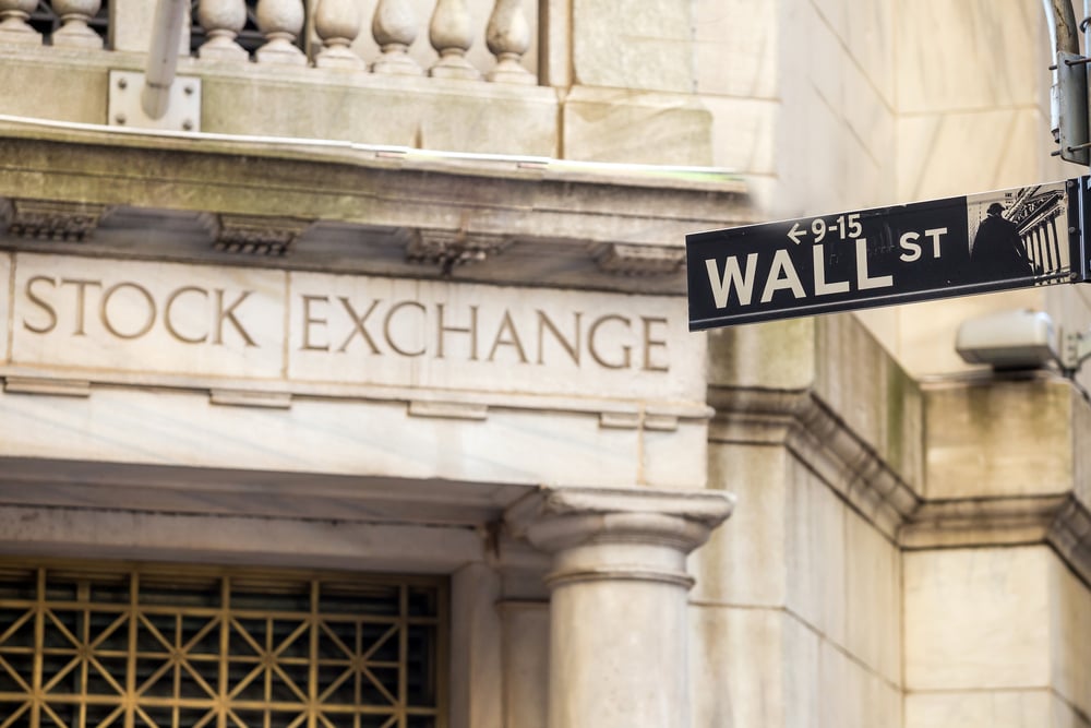 The New York Stock Exchange and Wall Street signs