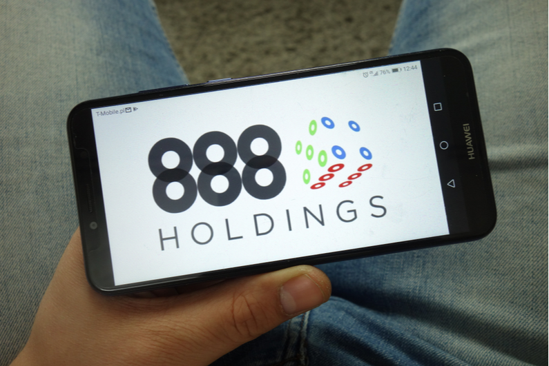 888 Holdings logo on a phone