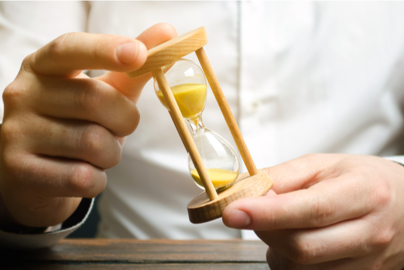 Man holding an hourglass